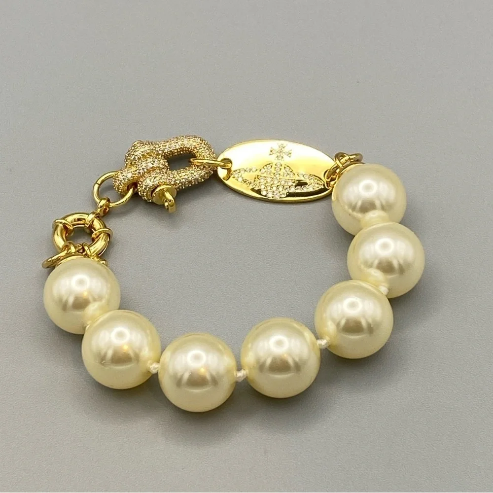 Vivienne Westwood large faux pearl bracelet with encrusted lock in gold tone